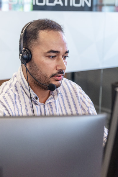 Engineer's wearing an headset supporting his customer